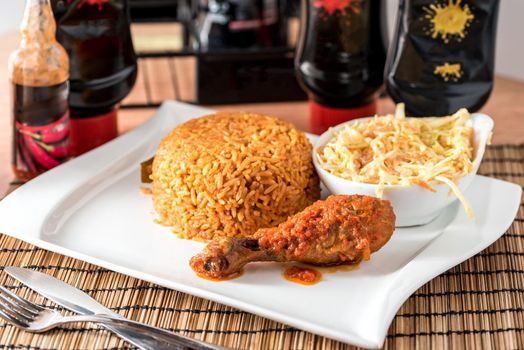 Regional African Food on white plate on wooden background