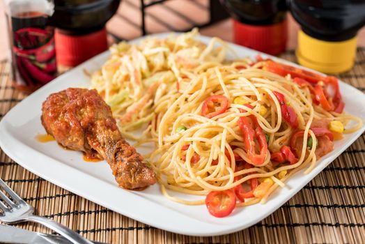 Regional African Food on white plate on wooden background