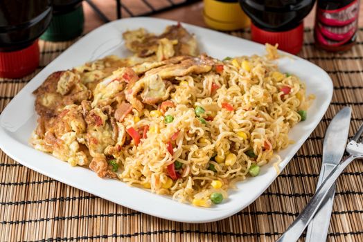 Regional African Food on white plate on wooden background