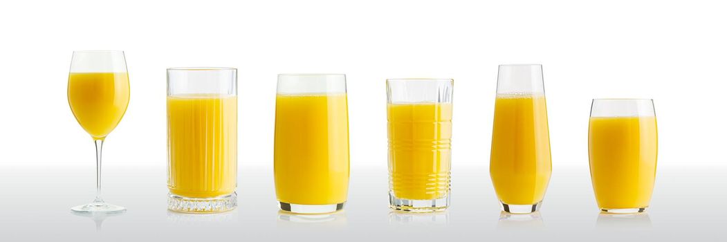 Collection of orange juice in different glasses . eparate clipping paths for each glass. Set of glasses with tropical orange juice