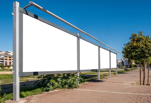 blank open air billboard megaboard mock up in the city on sunny day