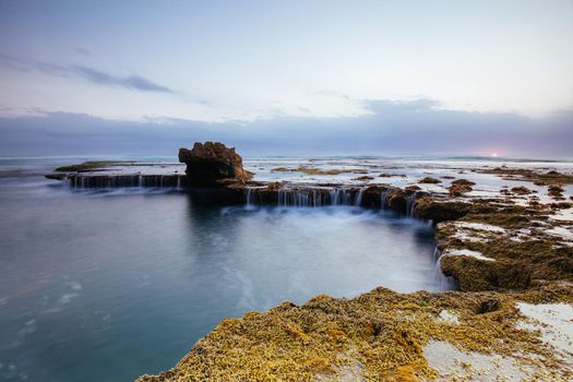 The iconic Dragon Head Rock at sunset on the Number Sixteen Beach in Rye, Victoria, Australia