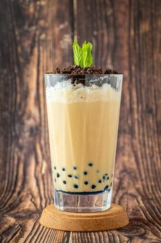 Fruity Bubble Tea in glass cup on wooden background