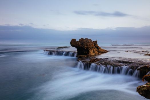 The iconic Dragon Head Rock at sunset on the Number Sixteen Beach in Rye, Victoria, Australia