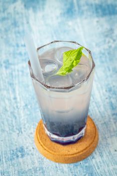 Fruity Bubble Tea in glass cup on blue background