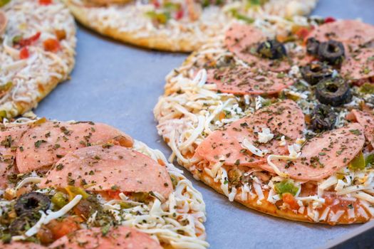 Frozen Italian pizza ready to be baked