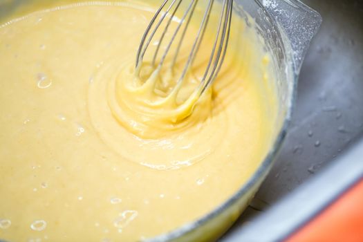 Motion blur photo of mixing homemade delicious cake