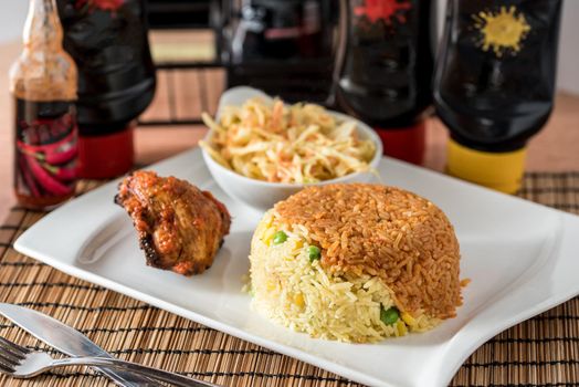 Regional African Food on white plate on wooden background