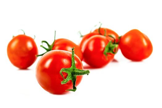 Fresh cherry tomatoes on a white background