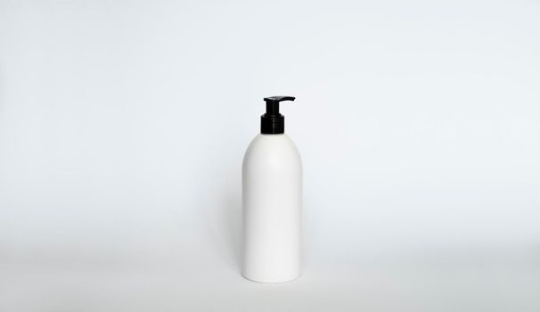 Liquid container for gel, lotion, cream, shampoo, bath foam. Cosmetic plastic bottle with black dispenser pump
