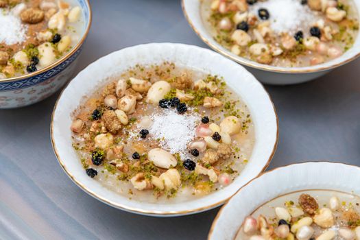 Traditional Turkish Dessert is Asure "Noah's Pudding" on wooden background