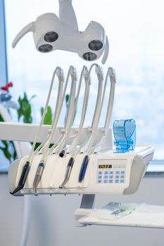 Modern dental practice. Dental chair and other accessories used by dentists