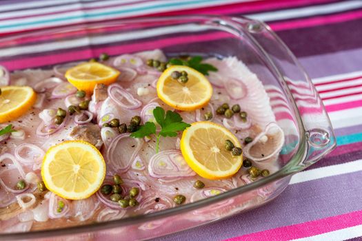 ray fish wings ready to prepare with capers, shallot and lemons