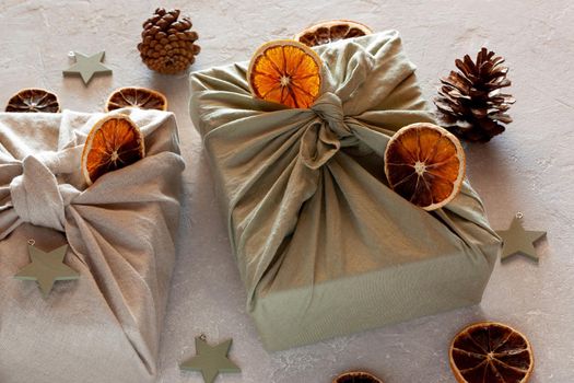 Christmas gifts textile packed, decorated with natural materials, zero waste concept