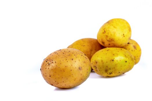 whole fresh potato on isolated white background