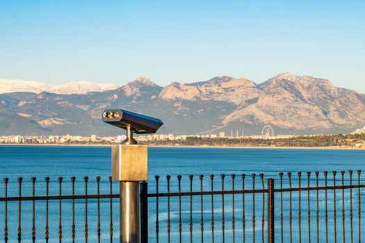 stationary observation binoculars at sunrise on a sunny winter day in Antalya Turkey