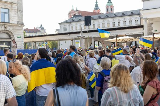 LJUBLJANA, SLOVENIA - August 24, 2022: Ukraine independence day meeting. People with flags and national symbols. High quality photo