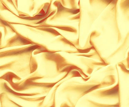 Luxury golden silk background texture - elegant fabric textures, abstract backgrounds and modern pastel colours concept