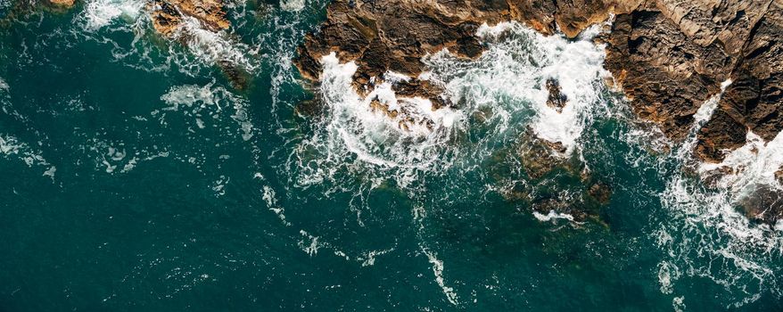 Aerial view of a blue beach with beautiful rocks. High quality photo