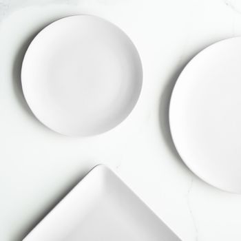 White empty plate on marble, flatlay - stylish tableware, romantic table decor and food menu concept. Serve the perfect dish