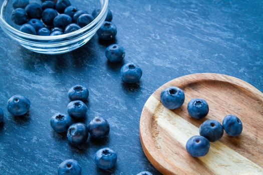 Blueberries on a wooden table. Fresh berries. Wild blueberries on a wooden stand. Copyspace.