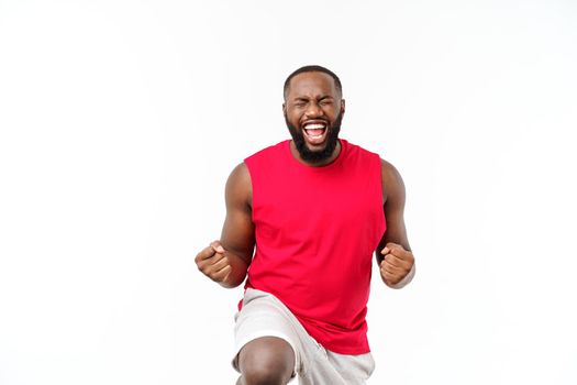 Young fitness african black man in sport wear cheering carefree and excited. Victory concept