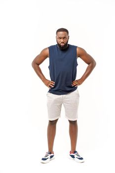 Young fitness african black man in sport wear cheering carefree isolated over white background