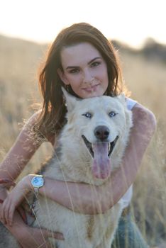 Everyone should have such a loyal friend. Portrait of an attractive young woman bonding with her dog outdoors