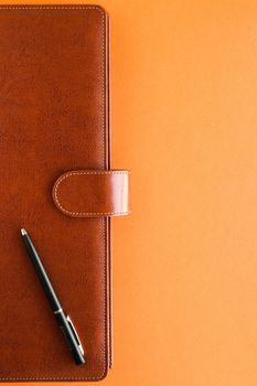 Modern workspace, productivity and corporate lifestyle concept - Luxury business brown brief-case on the office table desk, flatlay