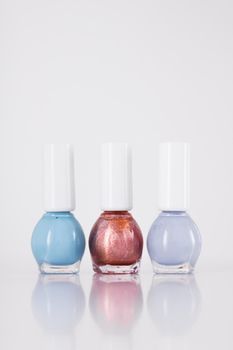 Beauty, make-up and cosmetics concept - Nail polish bottles, manicure and pedicure collection