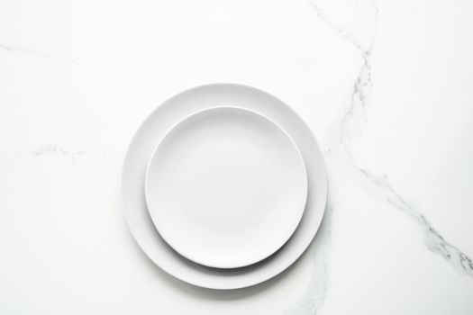 White empty plate on marble, flatlay - stylish tableware, romantic table decor and food menu concept. Serve the perfect dish