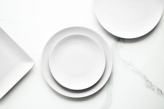 White empty plate on marble, flatlay - stylish tableware, romantic table decor and food menu concept. Serve the perfect dish