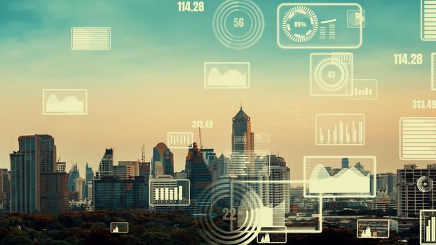 Business data analytic interface fly over smart city showing alteration future of business intelligence. Computer software and artificial intelligence are used to analyze big data for strategic plan .