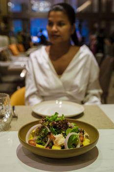 fresh salad with shrimp and mango in Thailand. colorful salad