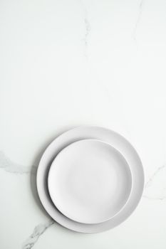 White empty plate on marble, flatlay - stylish tableware, romantic table decor and food menu concept. Serve the perfect dish