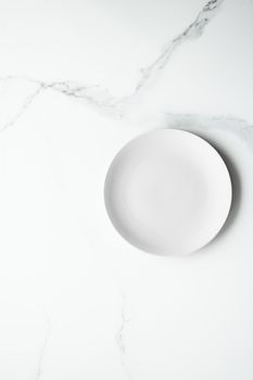 White empty plate on marble, flatlay - stylish tableware, romantic table decor and food menu concept. Serve the perfect dish