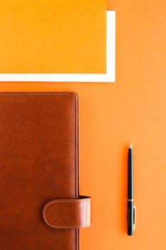 Modern workspace, productivity and corporate lifestyle concept - Luxury business brown brief-case on the office table desk, flatlay