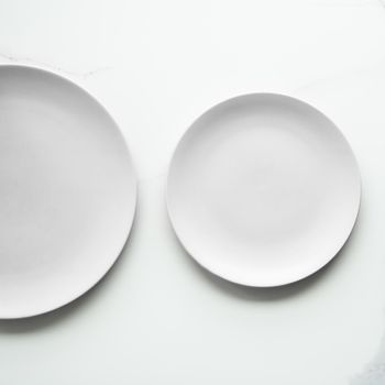 White empty plate on marble, flatlay - stylish tableware, romantic table decor and food menu concept. Serve the perfect dish