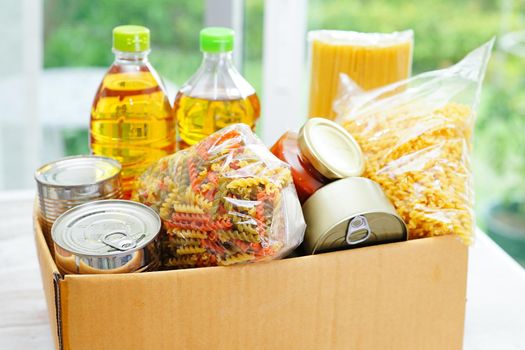 Foodstuffs in donation box for volunteer.