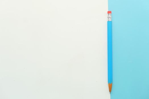 Close up of blue color pencils on color background