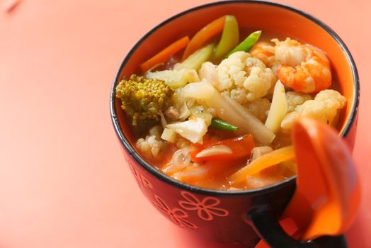 Close up of vegetable soup in bowl .
