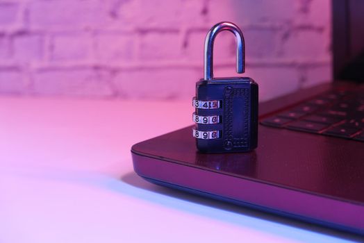 internet safety concept with padlocked on computer keyboard.