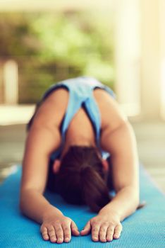 I do yoga every day. a young woman practising yoga