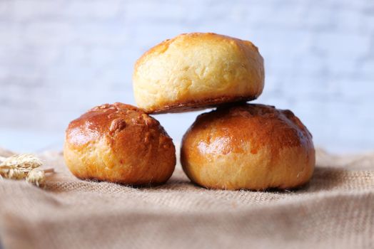 close up of stack of baked bread on table .