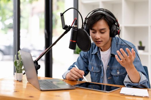 Man and woman podcasters interview each other for radio podcast.
