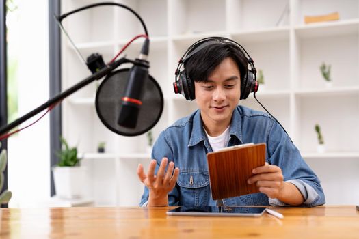 Man and woman podcasters interview each other for radio podcast.