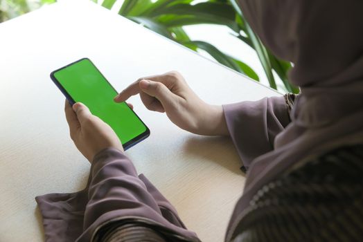 rear view of women hand holding smart phone ,