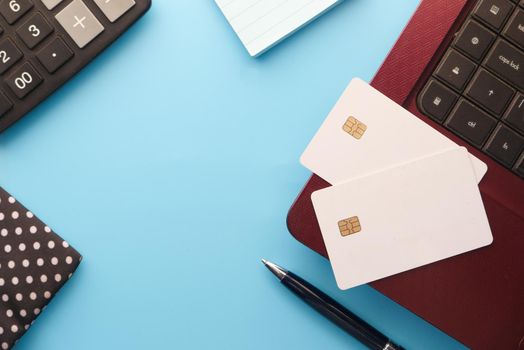 high angle view of credit cards on laptop on white background .