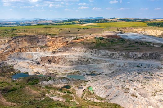 Aerial drone view flight over a quarry. Mining industry.