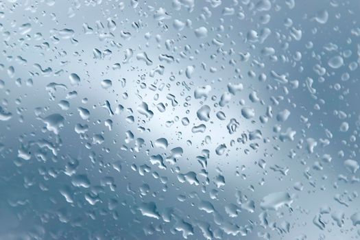 Close up of a window with raindrops. 